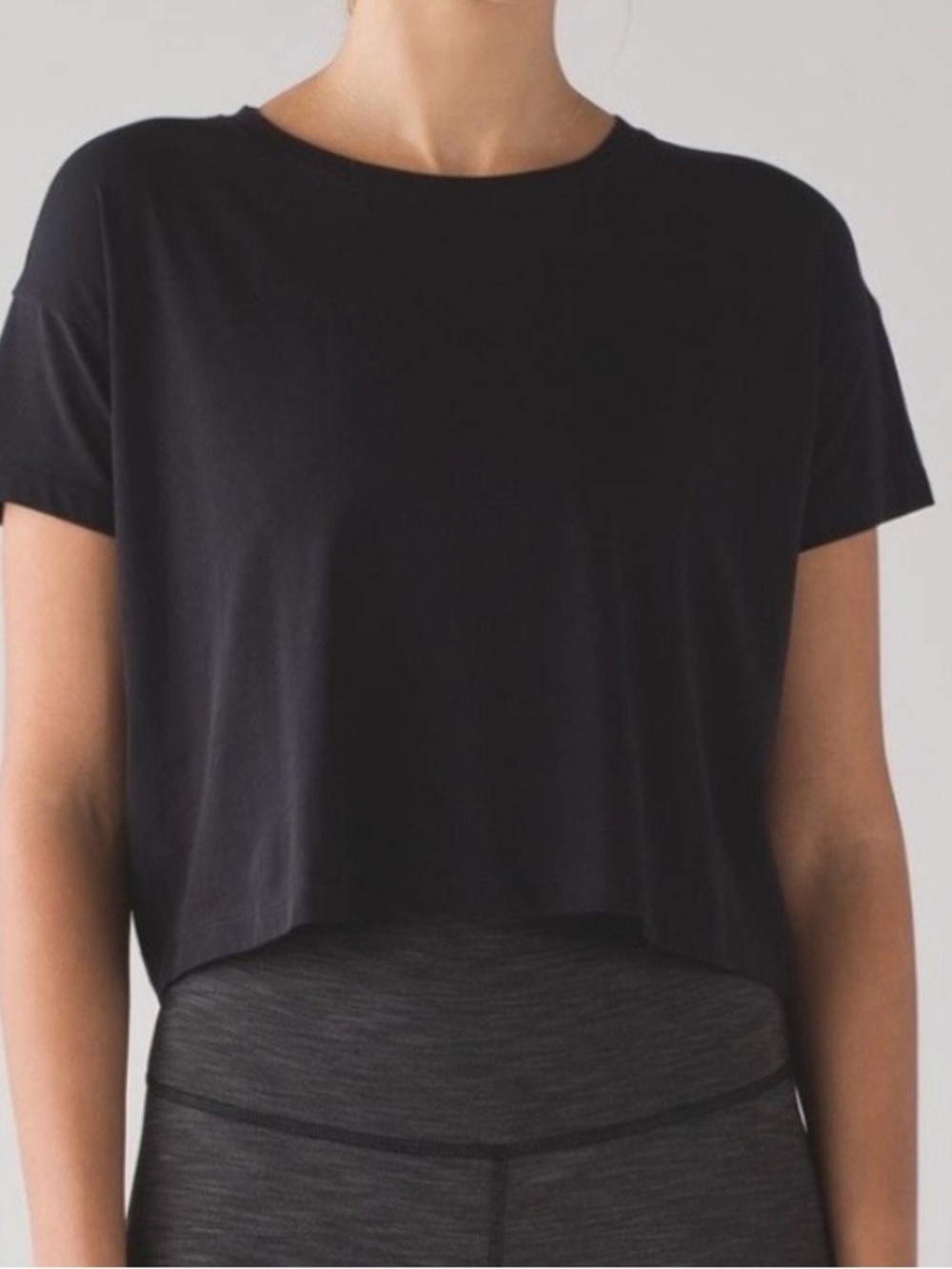 Lululemon black cropped short sleeve t-shirt.